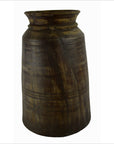Close-up of rustic brown wooden antique Indian milk storage container with wide mouth and visible grain texture.