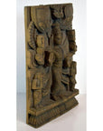 Brown sheesham wood carving of Shiva with multiple arms and attendants on decorative base, indoor display.