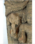 Close-up of brown Sheesham wood carving in antique Indian style, inspired by Tamil Nadu decor.