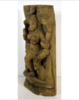 Brown Sheesham wood carving of a multi-armed Indian deity with jewelry, shown in an ornate pose.