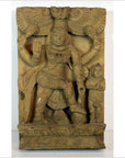 Brown Sheesham wood carving featuring multi-armed Indian deity and small figure on ornate base, close-up view.