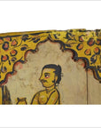 Close-up of antique Indian wood shrine with mustached man under arch, yellow and red floral accents, New Delhi origin.