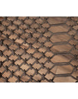 Close-up of brown wood side table with woven rope lattice, window grate design, and carved baluster legs indoors.