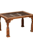Brown wooden side table with window grate top and turned baluster legs on white background.