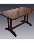 Wooden Indonesian dining table with plank top and double pedestal legs, displayed on a gray background.