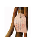 Brown paper tag with blue and red writing attached to metal sword and scabbard.