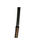 Close-up of brown textured handle and long dark blade of antique Indonesian sword, straight design.
