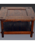 Brown wooden Indonesian table with lower shelf, visible joinery, Dutch Colonial inspired design, studio view.
