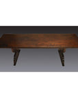 Dark wood antique Japanese desk with rectangular top and curved pedestal legs, studio background.