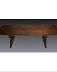 Dark wood antique Japanese desk with rectangular top and curved pedestal legs, studio background.