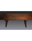 Dark wood antique Japanese desk with rectangular top and two curved, sturdy legs on each side.