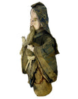Close-up of antique Japanese Edo samurai doll in patterned kimono with hood and beard, aged fabric, missing feet, on white.