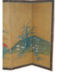Gold gilt Japanese screen with painted green hill, grasses, and wildflowers on rice paper, dark blue border.