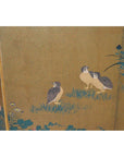 Antique Japanese gilt screen with three brown quails on green grass near plants, detailed scene.