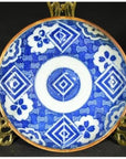 Blue and white ceramic Japanese Igezara transferware plate on brass stand.