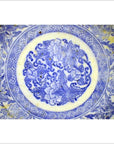 Blue and white ceramic Igezara transferware plate with circular floral and leaf pattern, close-up view.