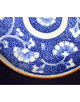 Blue and white porcelain Japanese Igezara transferware plate with floral patterns, close-up.