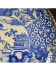 Close-up of blue and white porcelain Igezara Japanese transferware plate with intricate patterns.