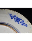 Close-up of a white porcelain plate with Japanese Igezara transferware detail.