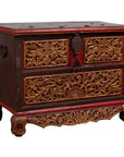 Brown hand carved wooden blanket chest with gilt accents, red details, two drawers, and decorative feet.
