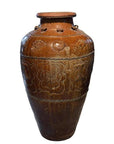 Brown ceramic antique Martaban water jar with carved patterns and slightly flared rim on white background.
