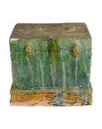 Close-up of rectangular green-glazed ceramic miniature Chinese treasure chest with brownish-orange accents.