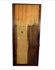 Antique mirror with multi-shade panels, visible wood grain, and a sturdy metal lock on right side, close-up view.