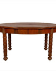 Brown wood antique oval dining table with spindle legs and warm patina, shown against a plain white background.