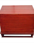 Red lacquer wood bedside cabinet with metal hardware from mid-19th century China on matching wooden stand.