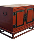 Red lacquer wood bedside cabinet with black trim, antique hardware, and two doors from mid-19th century China.