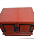 Red lacquer wood bedside cabinet with metal hardware, mid-19th century China, photographed on a white background.