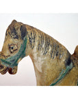 Close-up of a green-brided glazed terracotta Ming Dynasty horse with textured mane.