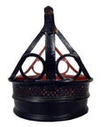 Close-up of a round black basket with geometric cutouts and triangular lid supports, antique Thailand style.