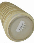 Beige ceramic vase with earth tones lying on its side, visible MADE IN THAILAND barcode sticker underneath.