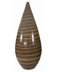 Close-up of large ceramic vase with glossy finish, brown and tan stripes, tall teardrop shape.