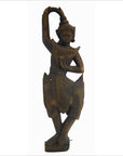 Brown wood Balinese hand carved temple dancer wall decor, shown on a 27 inch shelf.