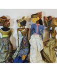 Colorful batik fabric Balinese puppets with backs facing camera, four grouped together.