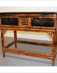 Black lacquered bamboo desk or console with decorative latticework, vintage-inspired style.