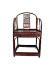 Brown bamboo horseshoe chair with curved arms and geometric backrest, on a white background.