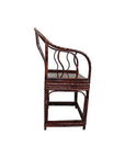 Brown bamboo horseshoe chair with curved backrest and wavy slats, side view, on white background.