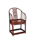 Brown bamboo horseshoe chair with curved back, geometric lattice design, and slender arms and legs, indoor setting.