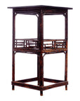 Brown bamboo-style tall lamp table with square top and decorative railings, open frame, close-up view.