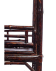 Close-up of lacquered bamboo-style lamp table with geometric design, shown against a white background.