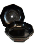 Glossy black hexagonal baskets with lids, one partially open, each showing a small white sticker inside.
