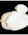 White porcelain duck with a unique shape against a black background.