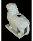 White porcelain Foo-Dog with curly mane, rectangular base, and round opening on back, Blanc de Chine style.