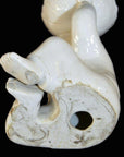 White porcelain monk figurine, ceramic material, shown against a plain background.
