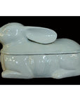 White porcelain rabbit with removable lid, Blanc de Chine style, displayed against a black background, close-up.