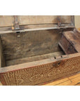 Open wooden blanket chest with white bone inlay displayed on a wooden floor, empty interior visible.