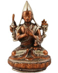 Bronze and silver brass statue of a seated Buddhist monk in meditative pose, hand-cast, close-up.